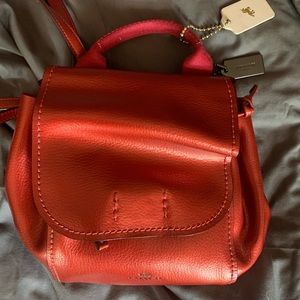 Red coach shinny leather backpack
